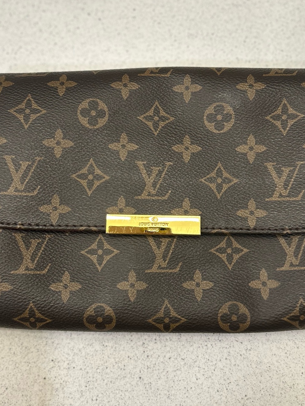 Louis Vuitton Monogram Canvas Clutch in Brown with Gold Accent
